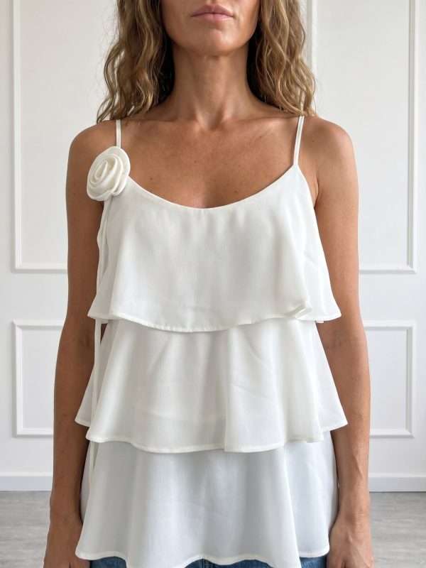 Top elegante da donna Operà Fashion bianco con balze e fiore applicato
