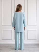 Retro completo donna elegante Chiara Bruni con blusa e pantalone dal taglio fluido